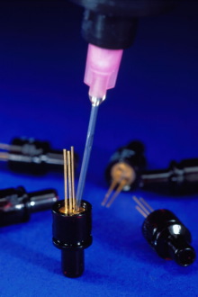 FAST-CURE, LOW-SHRINK ADHESIVE FOR OPTIC ASSEMBLY ELIMINATES PARTS MOVEMENT  